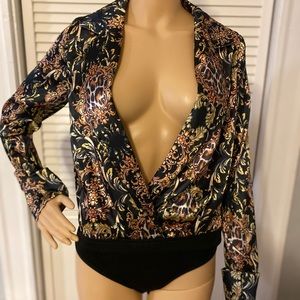 Bodysuit Blouse from pretty little thing. The top can be little too wide.